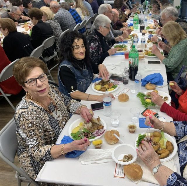 seniors in dining hall enjoying lunch