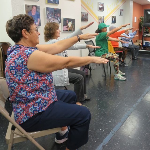 active life program with seniors doing yoga