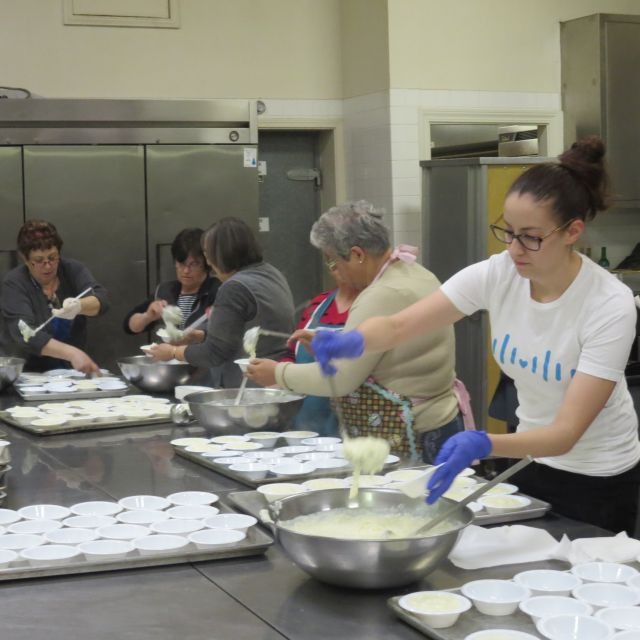 volunteers baking pastries for fundraiser